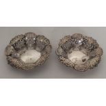 A pair of small silver bonbon dishes decorated wit