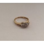 An 18 carat gold diamond cluster ring. Approx. 3.4