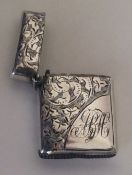 A good quality silver engraved vesta case with hin