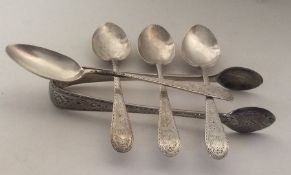 A set of four silver teaspoons together with match