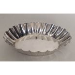 A silver bonbon dish with crimped rim. London 1890