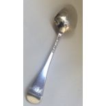 A Georgian silver scroll back tablespoon with init