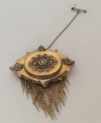 AN attractive Victorian gold brooch with tassel dr