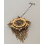 AN attractive Victorian gold brooch with tassel dr
