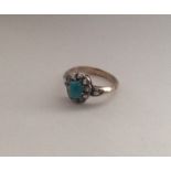 A turquoise and diamond cluster ring. Approx. 2.9