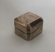 A novelty silver ring box with cut corners and hin