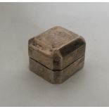A novelty silver ring box with cut corners and hin