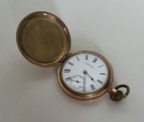 A gold plated open faced pocket watch, by Waltham.