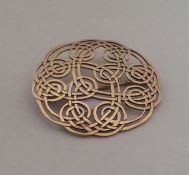 A Celtic 9 carat brooch. Approx. 7.7 grams. Est. £