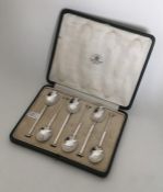 A boxed set of six silver nail top teaspoons. Lond