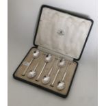 A boxed set of six silver nail top teaspoons. Lond
