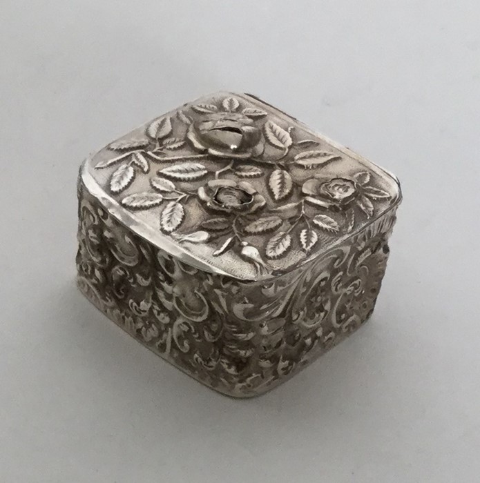 A square silver chased box. Birmingham 1890. Appro