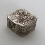 A square silver chased box. Birmingham 1890. Appro