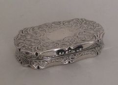 An oval Victorian silver engraved snuff box with g