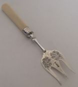 A silver pierced fork on tapering handle. Sheffiel