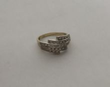 A 9 carat fan shaped ring with fancy setting. Appr