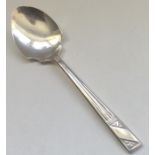 A stylish Edwardian silver jam spoon with fluted h