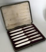 A cased set of six silver and shell mounted tea kn