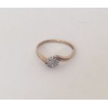 A small diamond cluster ring set in 9 carat. Appro