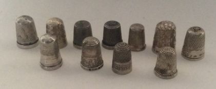 A group of silver engraved thimbles. Various dates