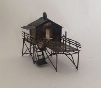 A Chinese silver miniature stilt house. Approx. 30