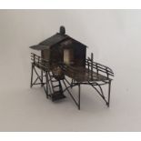 A Chinese silver miniature stilt house. Approx. 30