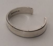 TIFFANY & CO: A silver torque bangle. Approx. 70 g