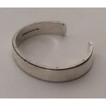 TIFFANY & CO: A silver torque bangle. Approx. 70 g