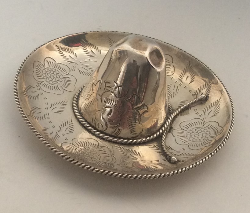 An unusual silver pin dish in the form of a sombre