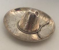 An unusual silver pin dish in the form of a sombre