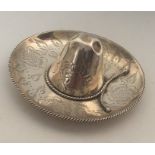 An unusual silver pin dish in the form of a sombre