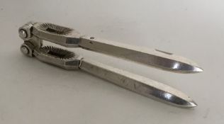 A pair of Continental silver walnut crackers. Appr