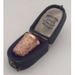 A 9 carat thimble contained within a fitted box. A