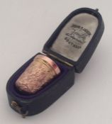 A 9 carat thimble contained within a fitted box. A