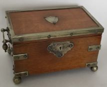 An oak and silver plated jewellery box with fitted