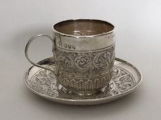 A Victorian silver cup and saucer. London 1894. Ap