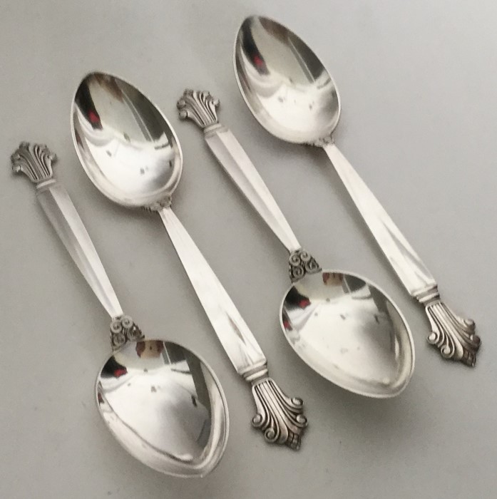 GEORG JENSEN: A set of four silver dessert spoons