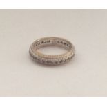 A 9 carat garnet mounted eternity ring. Approx. 3