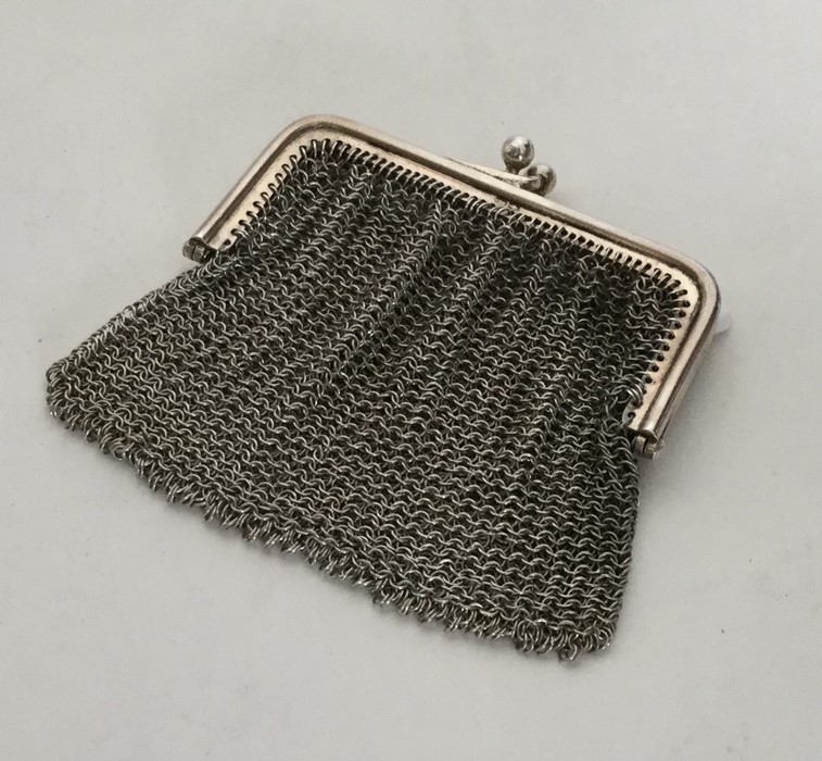 A silver mesh purse with loop top. Approx. 50 gram