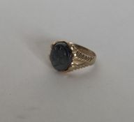 A gent's 9 carat signet ring with crested mount. A