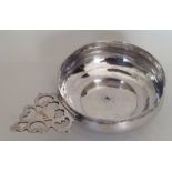 A rare Queen Anne silver porringer with scroll cas