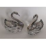 A pair of silver and glass figures of swans. Appro