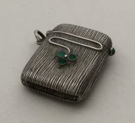 A stylish silver vesta inset with cabochon stones.