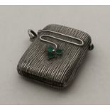 A stylish silver vesta inset with cabochon stones.