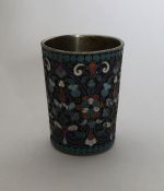 An early Russian silver and enamel vodka tot of ta