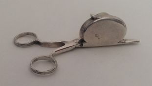 A pair of George I silver snuffers of typical form