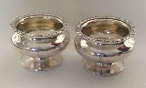 A good pair of Georgian circular silver salts with