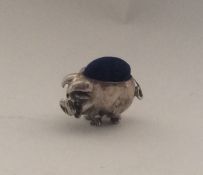 A novelty miniature silver pin cushion in the form