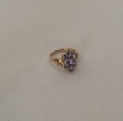 A seven stone ring in stylish 9 carat mount. Appro