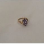 A seven stone ring in stylish 9 carat mount. Appro